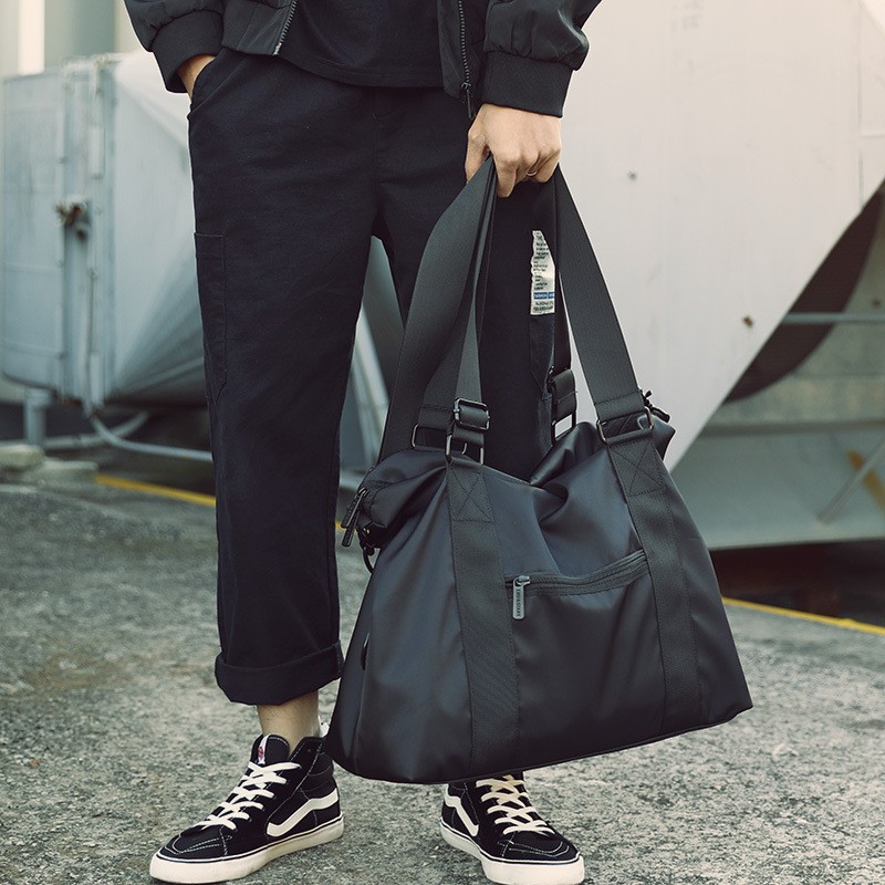 Spacious men nylon duffle bag with detachable shoulder strap, large capacity, lightweight, perfect for travel, gym and daily commuting.